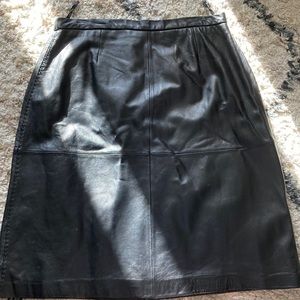 Cute Black Leather Skirt.  Stretch waist, with zipper.Size 18 P.